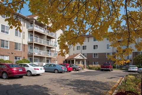 Osceola Place exterior of community with pretty fall colors on trees